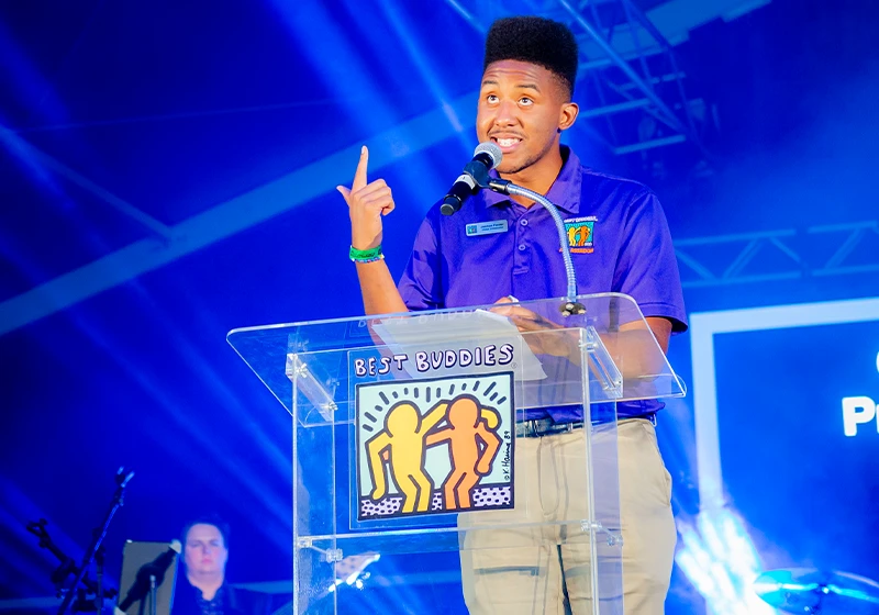 Best Buddies Ambassador, Joshua Felder, giving a speech.