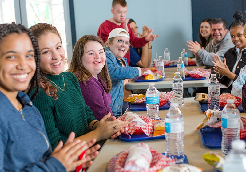 Best Buddies school chapter members eating lunch together